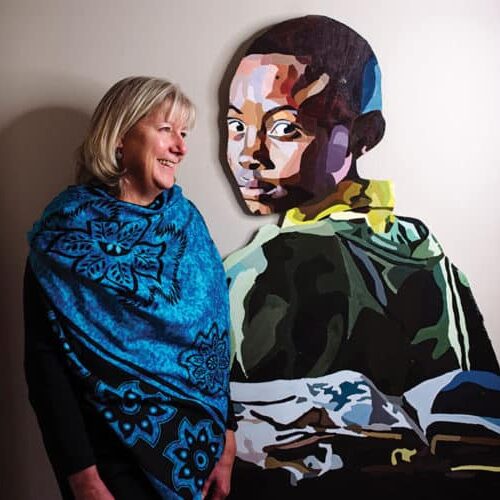 Sharon Runge stands near a gift painted by her daughter, Emma Runge, in their family home.